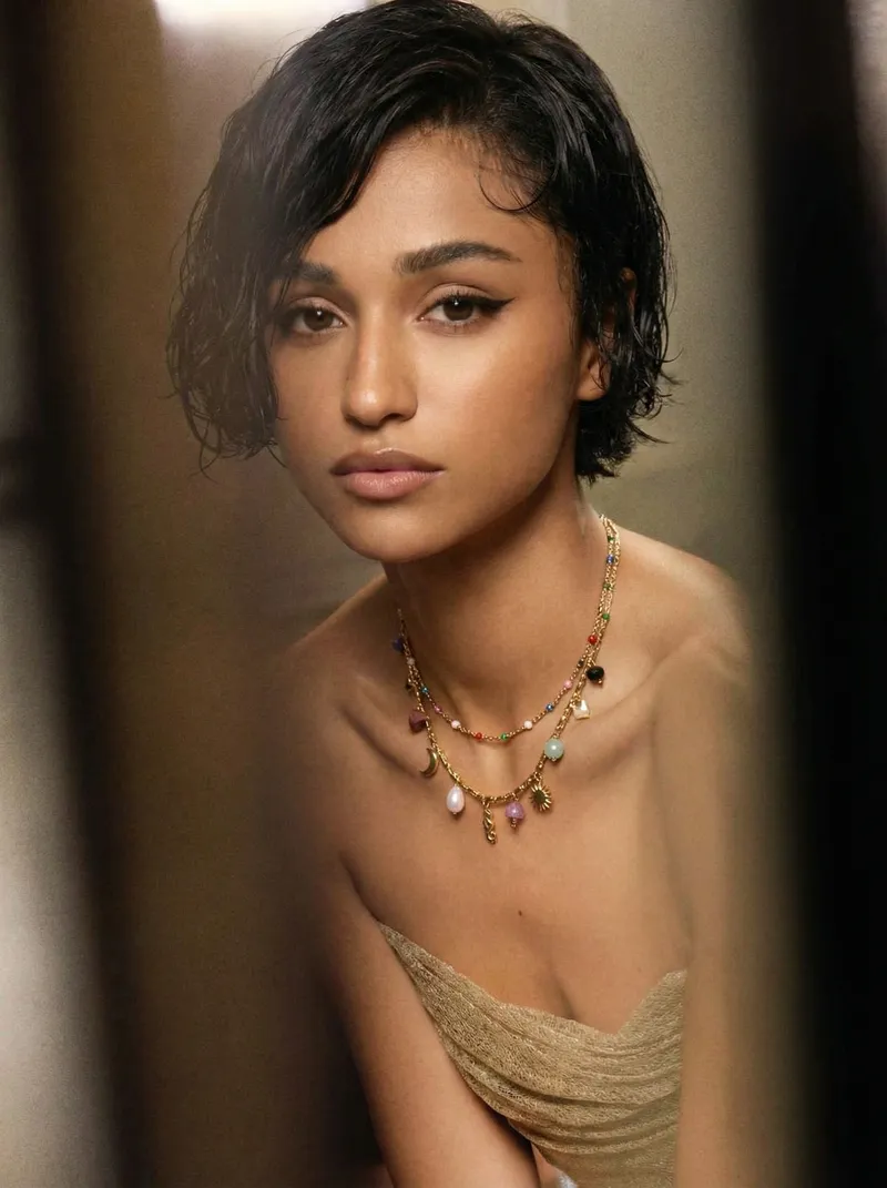 Golden Cinema: warm amber tones, shot through doorframe, gold lace top