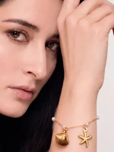 FormaNova AI-generated model photo wearing the same gold charm bracelet, jewelry preserved